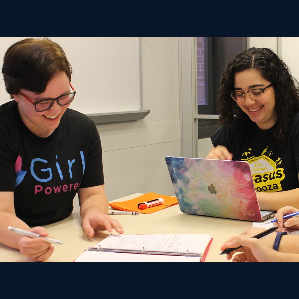 Two students working at a table