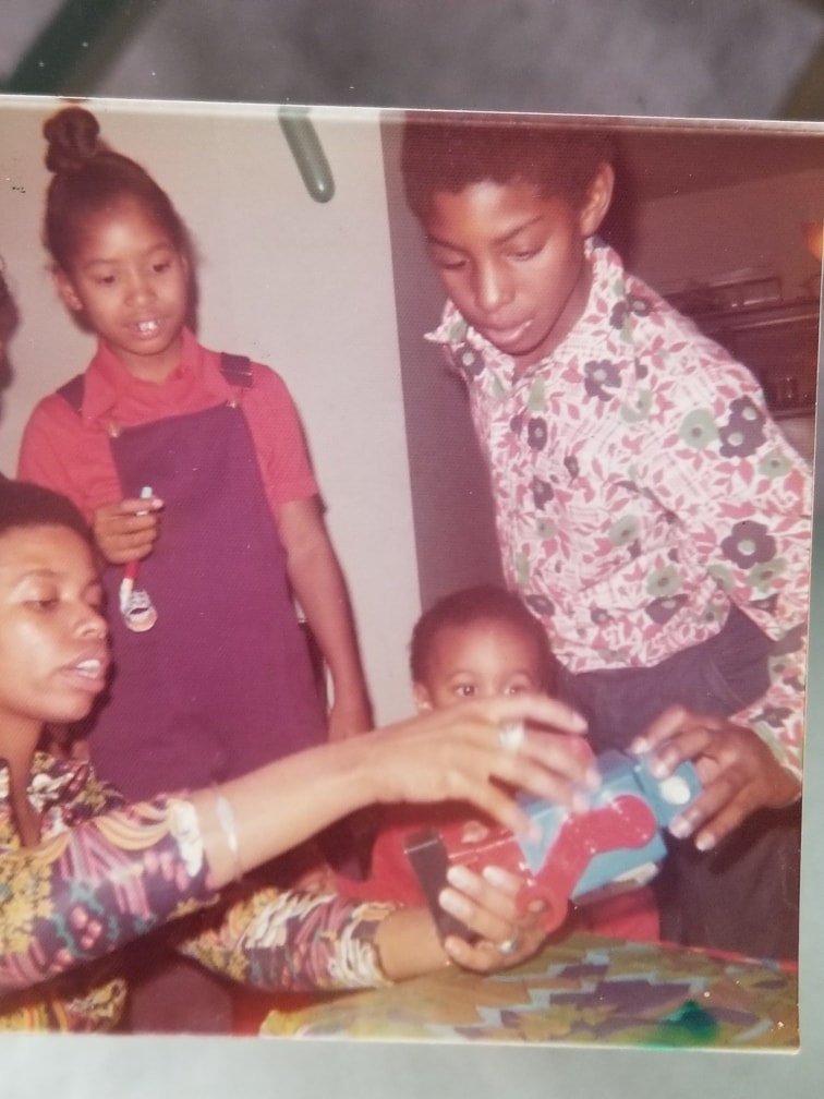 Aprille working on a robot as a little girl.