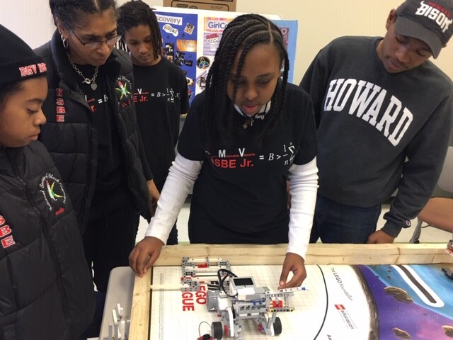 Aprille working with her Lego team.