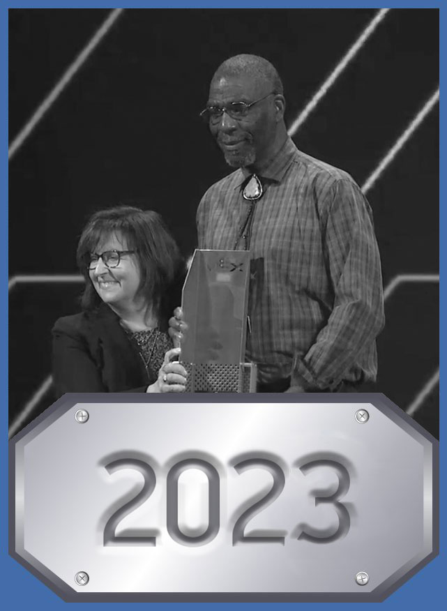 Nate Raynor accepts award on stage at 2023 VEX Robotics World Championship