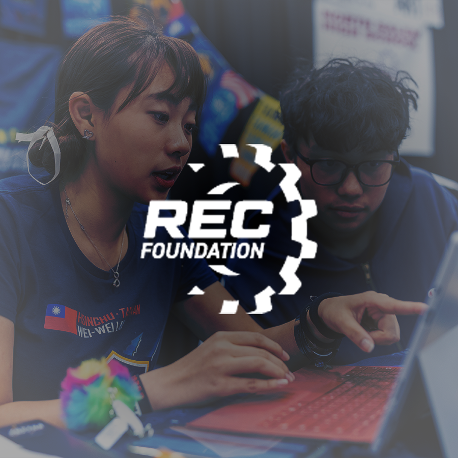 Team works on a laptop in the pits at VEX Robotics World Championship