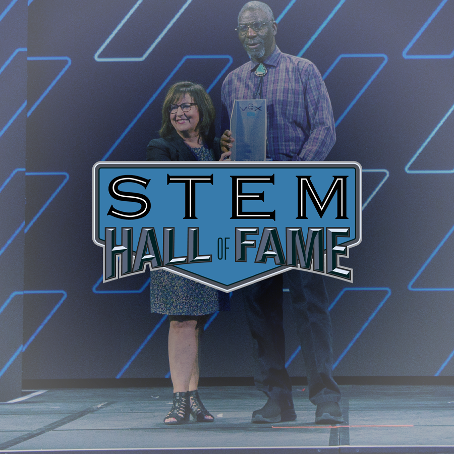 Inspiration All Star holds award on stage at VEX Robotics World Championship