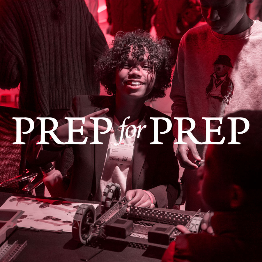 Participant works on robot at Prep for Prep event