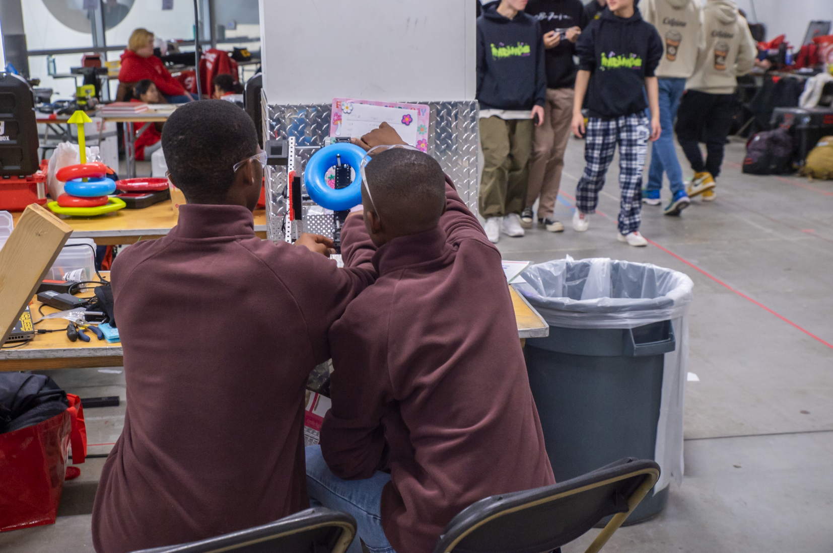 Team works on their robot at an event.