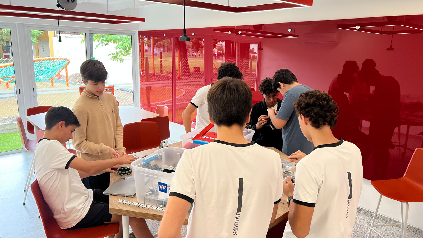 Students work on their robot on a classroom