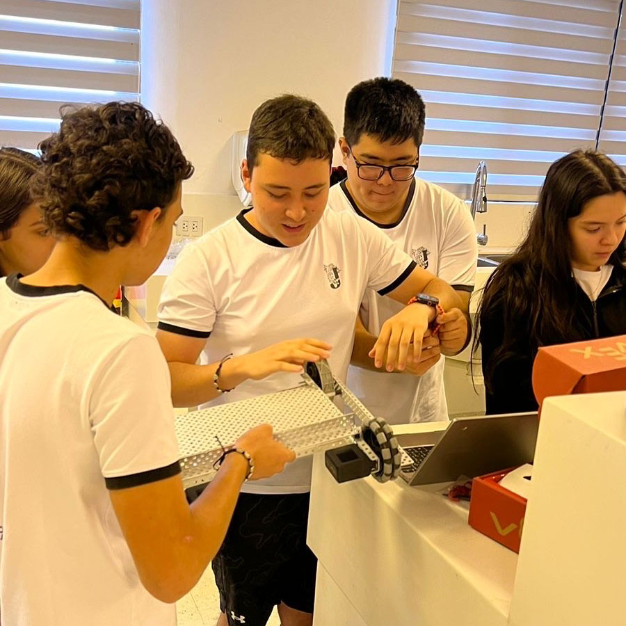 Students work on their robot on a classroom