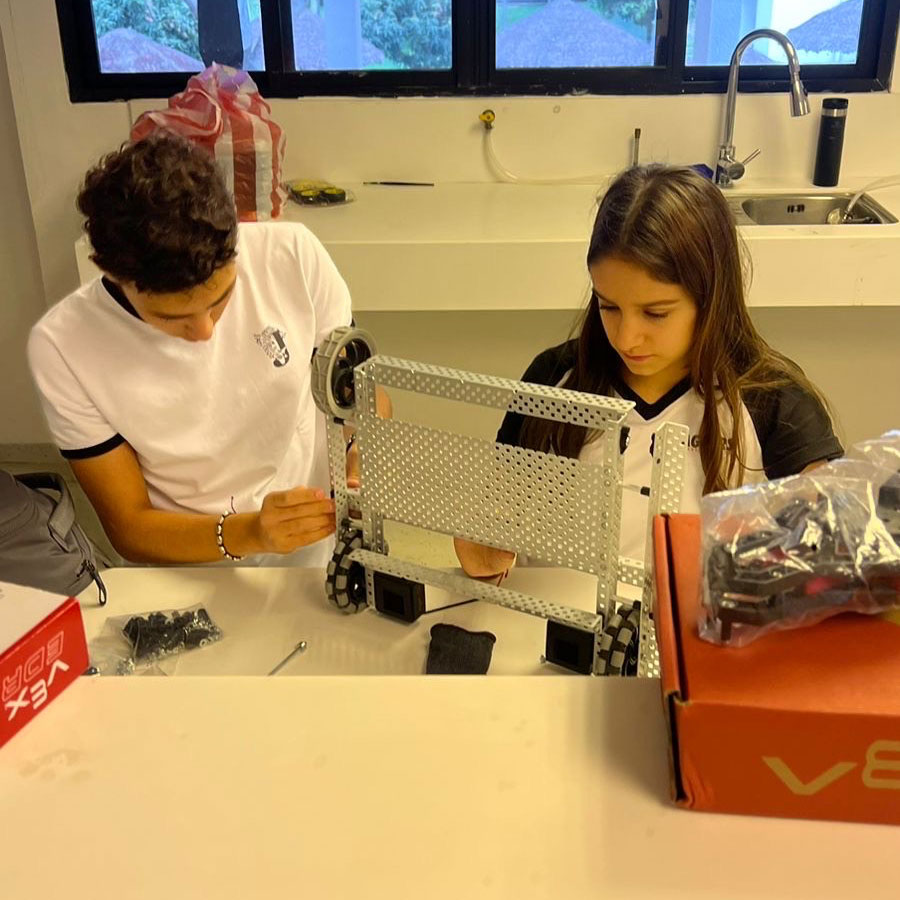 Students work on their robot on a classroom