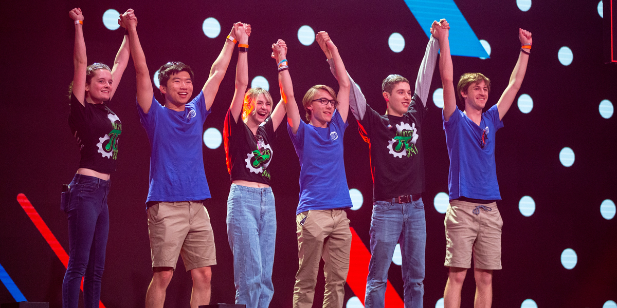 Team celebrates on stage at the VEX Robotics World Championship
