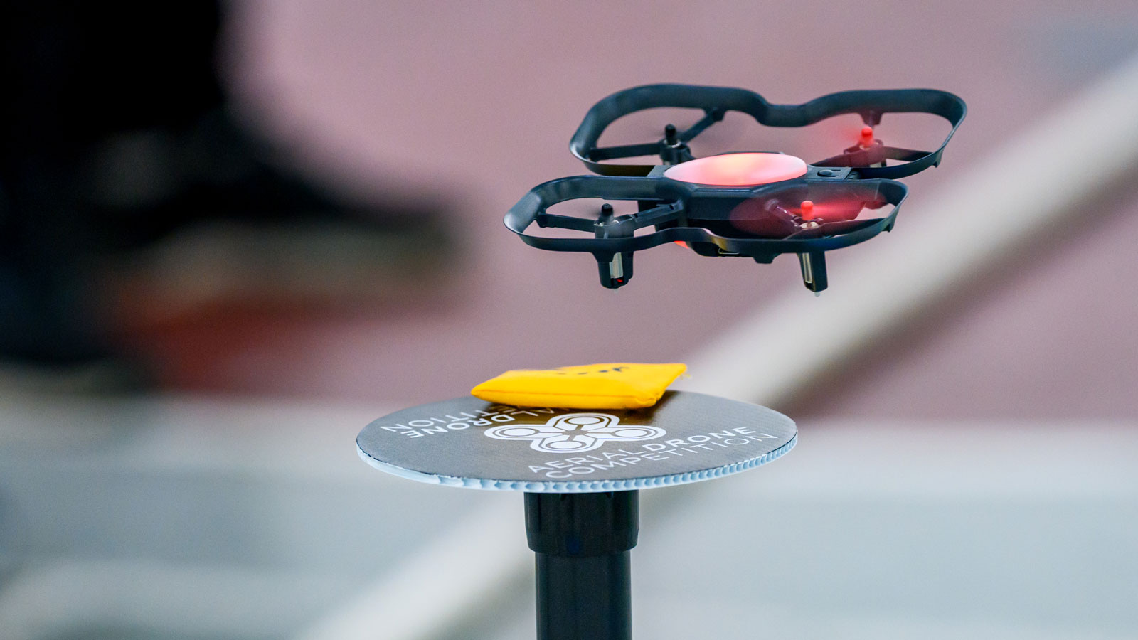 Drone lands on a game element at an Aerial Drone Competition event