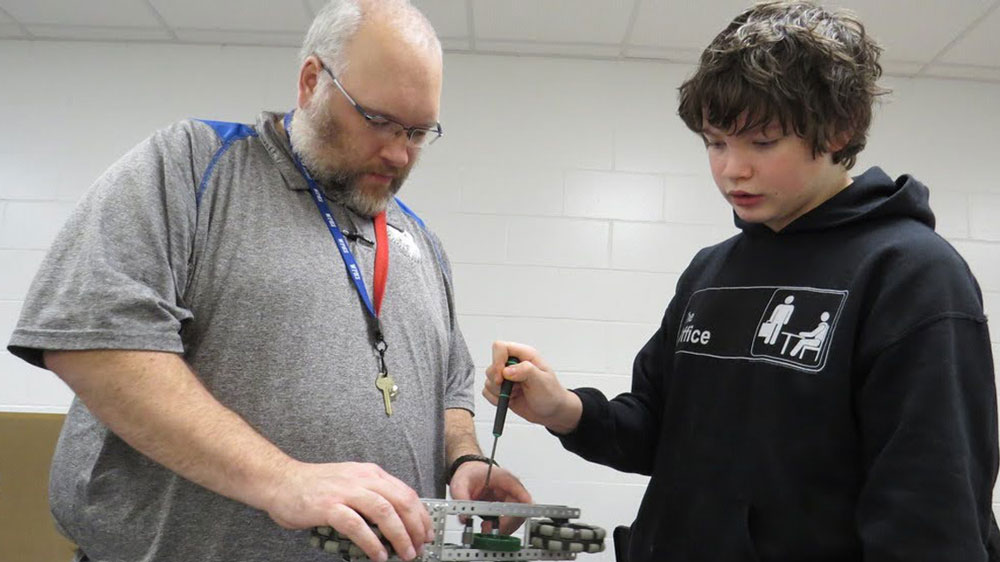 Mentor and student work on a report