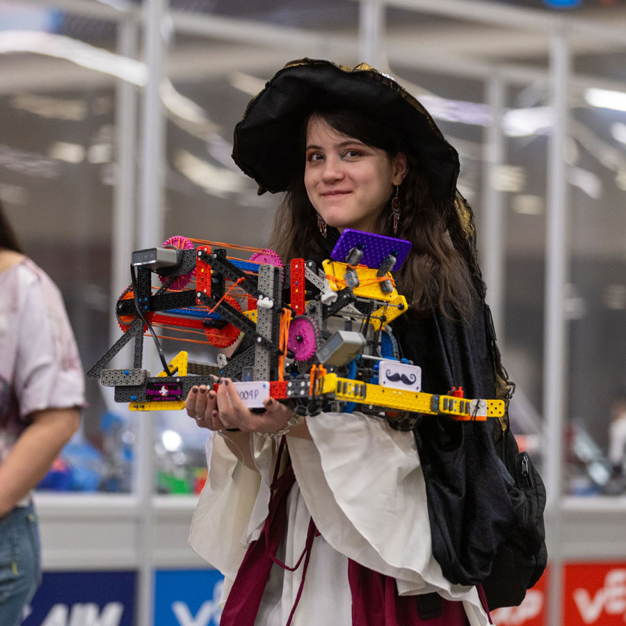 Participant carries her robot at VEX Robotics World Championship