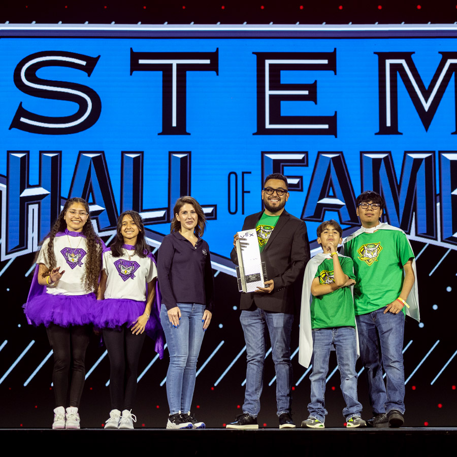 Omar Cortez accepts the Inspiration All Star Award alongside his students at the 2025 VEX Robotics World Championship