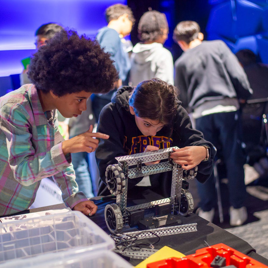 Teams works on a robot