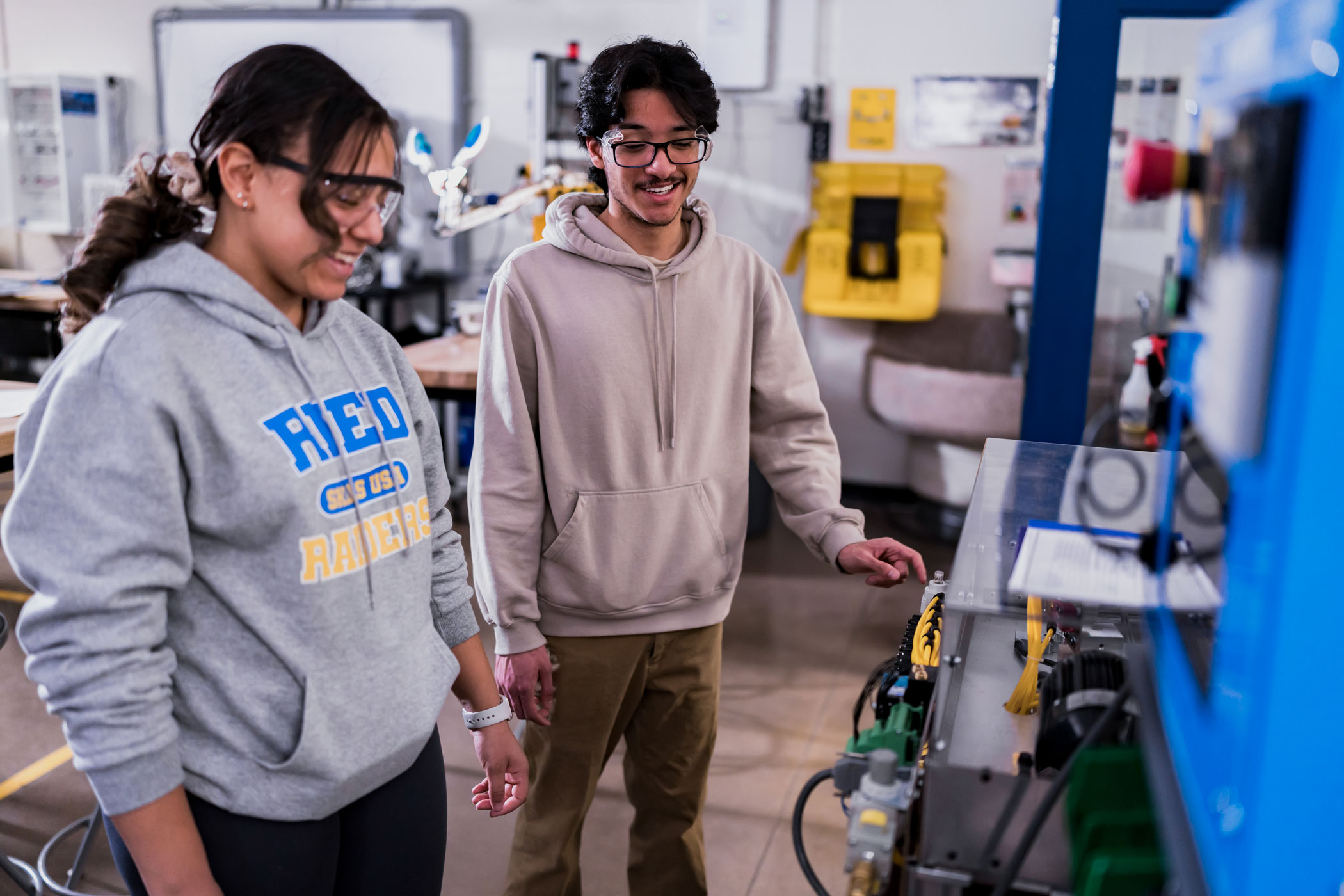 Students work with machinery