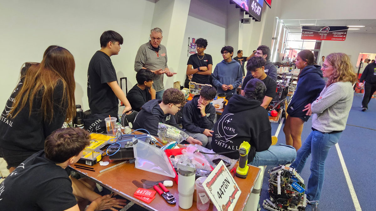 Robotics coach Bill McDonough with his students